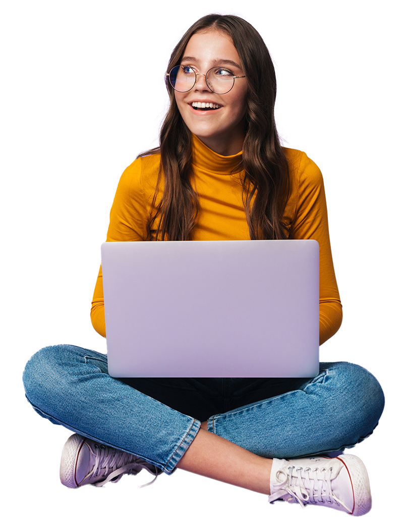 Smiling person sitting cross-legged with a laptop, wearing a yellow shirt and jeans, against a purple background.